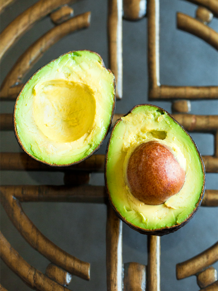 Whole Avocado Sliced Open With Pit Whole Avocado Sliced Open With Pit