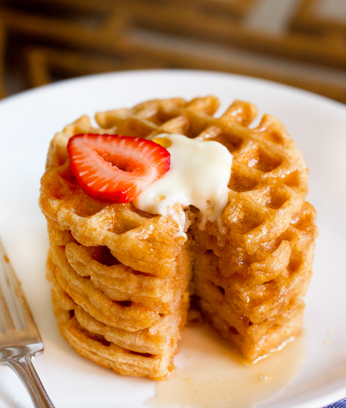 Protein Waffles topped with Strawberries, Butter, and Maple Syrup
